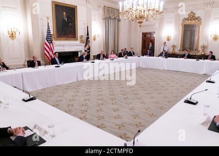 President Trump Meets with Republican Members of Congress. President Donald J. Trump listens to House Minority Leader Rep. Kevin McCarthy, R-Calif., during a meeting with Republican members of Congress Friday, May 8, 2020, in the State Dining Room of the White House. Stock Photo