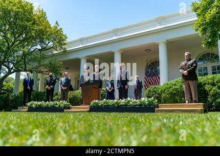 President Trump Delivers an Update on Vaccine Development. President Donald J. Trump listens as General Gustave Perna, Commanding General of the U.S. Army Material Command, delivers remarks during an update on vaccine development Thursday, May 15, 2020, in the Rose Garden of the White House. Stock Photo