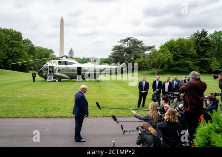 President Donald Trump speaks to reporters outside the White House after returning from a weekend at Camp David on May 17, 2020. Stock Photo
