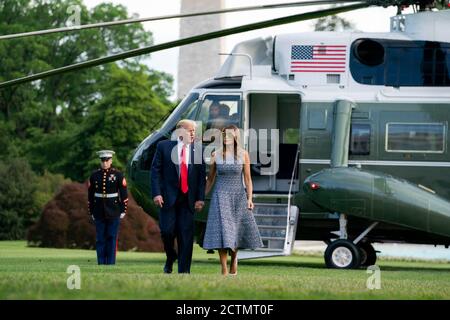 President Trump and the First Lady Return to the White House. President Donald J. Trump and First Lady Melania Trump walk across the South Lawn of the White House Wednesday, May 27, 2020, returning from their trip to the Kennedy Space Center in Cape Canaveral, Fla. Stock Photo