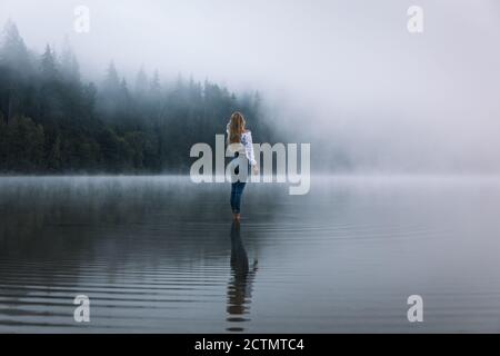 Plastic clothes. Professional blonde-haired model posing in plastic clothes  participating in ecology campaign Stock Photo - Alamy