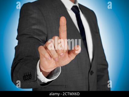 Businessman touching a virtual screen Stock Photo
