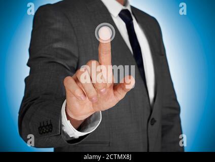 Businessman touching a virtual screen Stock Photo