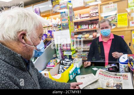 Ardara, County Donegal, Ireland 24th September 2020. A senior man buys his daily newspaper amidst concern at the increasing number of cases of Coronavirus, Covid-19, in the north-west county. Stock Photo