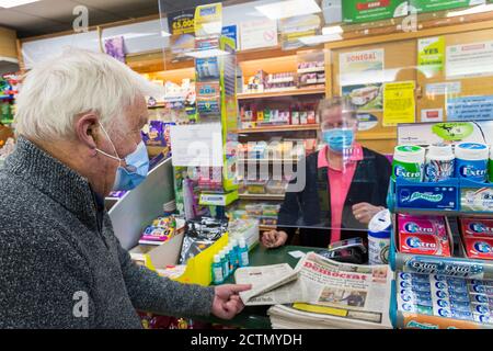 Ardara, County Donegal, Ireland 24th September 2020. A senior man buys his daily newspaper amidst concern at the increasing number of cases of Coronavirus, Covid-19, in the north-west county. Stock Photo
