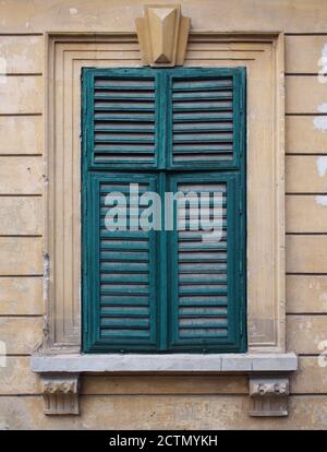 Old window with wooden blinds Stock Photo