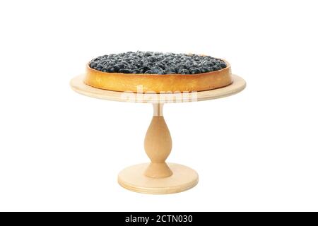 Wooden board with blueberry pie isolated on white background Stock Photo