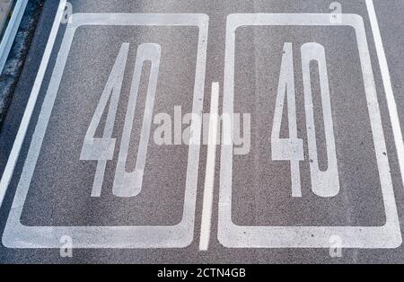 Forty Kilometers or Miles Per Hour Speed Limit Sign in Road Paint. Top view Stock Photo