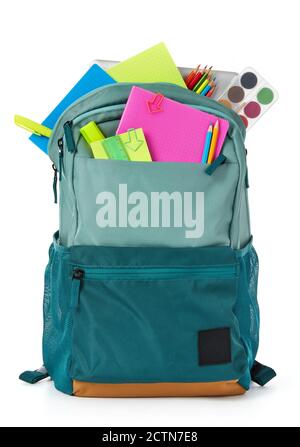 School supplies and backpack on white background Stock Photo