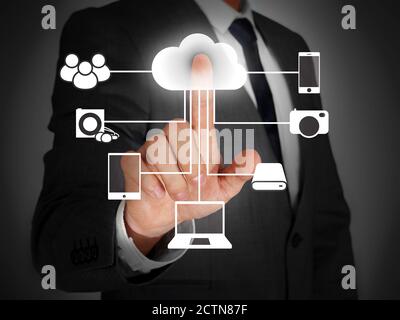 Businessman touching a virtual screen Stock Photo