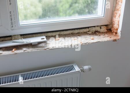 Repair in the slopes of the window. The process of applying a layer of plaster on the sides of the window. Stock Photo