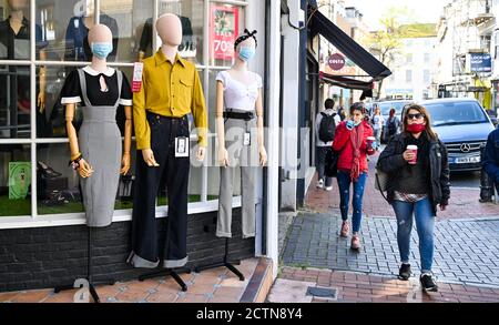 Brighton UK 24th September 2020 - Shoppers in Brighton some wearing face masks as the new government COVID restrictions are brought in throughout England today with pubs and restaurants having to close at 10pm tonight : Credit Simon Dack / Alamy Live News Stock Photo