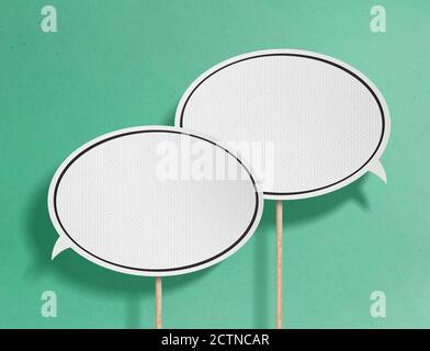 Speech bubbles on green background Stock Photo