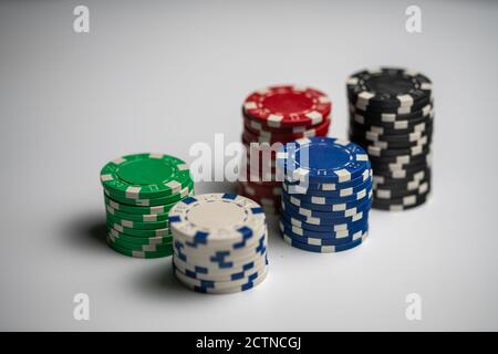 five stacked poker chips in different colors Stock Photo