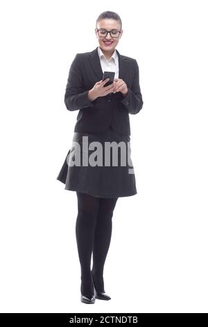 in full growth. smiling businesswoman reading a message on her smartphone. Stock Photo