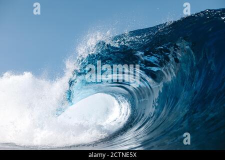 Powerful blue breaking ocean waves with white foam Stock Photo