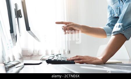 Software developer or programmer working data debugging improvement binary algorithm on desktop pc in a software develop company office Stock Photo