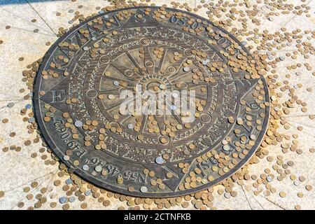 Kazan, Russia – June 27, 2017. Directional marker at Kazan Wedding Palace in Kazan, with Russian coins. Stock Photo