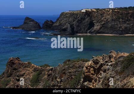 Portugal, Algarve Region, Odeceixe, South-West Alentejo and Vicentine Coast Natural Park cliff top view of the waves washing onto Odeceixe beach. Stock Photo