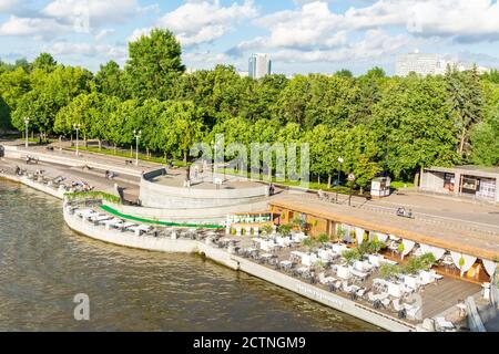 Moscow, Russia – July 3, 2017. View of Pushkinskaya Embankment along the Moskva River and Olive Beach area at the Gorky Park in Moscow. Stock Photo