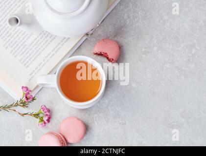 Tea and macaroons on table Stock Photo