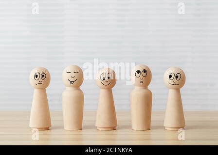 Wooden people figures on desk table Stock Photo