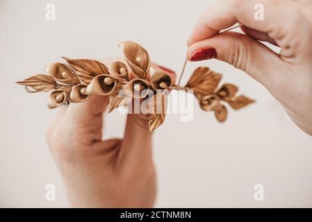 unrecognizable crop talented craftsWoman making decorative flowers in workshop while working on project Stock Photo