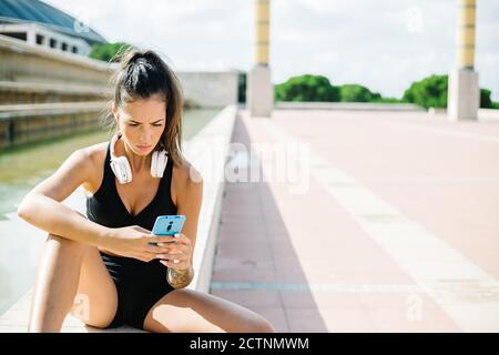 Fit Woman's Ribs Slim and fit woman with tattoo on her ribs enjoying amazing yoga time ...