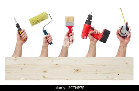 Hands raised holding different tools with copy space Stock Photo