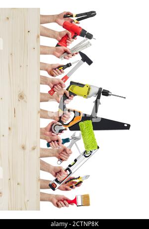 Hands raised holding different tools with copy space Stock Photo