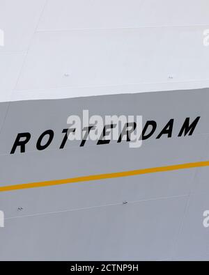 The name of the ship SS Rotterdam as painted on the bow in black letters on a gray background underlind with a yellow stripe. The lines and marks of t Stock Photo