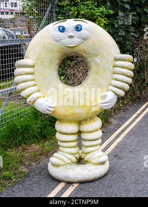 Doughnut man mascot, advertising doughnuts for sale at a shop in West Looe, Cornwall, England, UK. Stock Photo