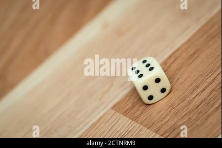 White game dice with number six on the floor Stock Photo
