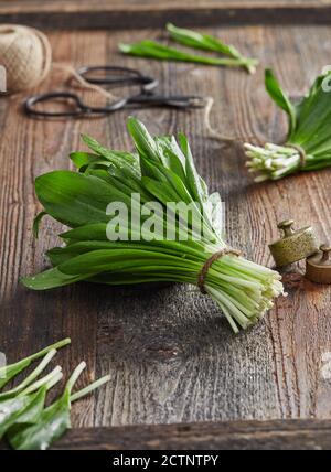 Wild garlic leafs on wood table Stock Photo