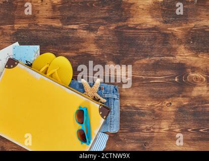 Suitcase full with clothing and personal accessories Stock Photo