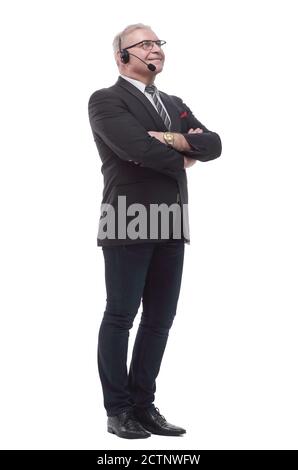 side view. mature business man in headset looking at white blank screen Stock Photo