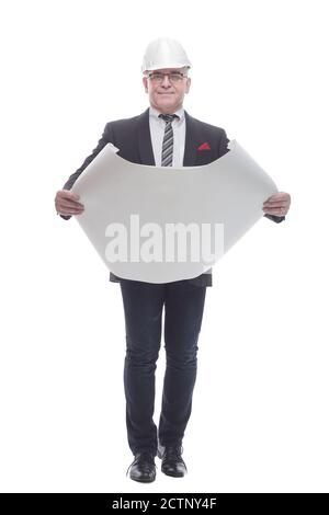 side view. smiling architect reading a new drawing. Stock Photo