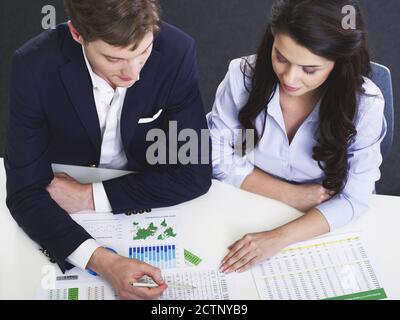 Business people working on financial documents Stock Photo