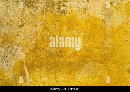 Yellow old dirty concrete wall texture or background Stock Photo