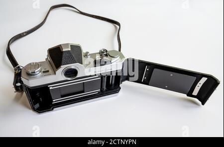 Nikon Nikkormat FTN SLR camera body with open camera back cover. Stock Photo