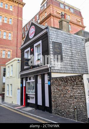 The Queensbury Arms formerly known as The Hole in the Wall is Brighton's smallest pub tucked behind the Metropole Hilton Hotel which is up for sale UK Stock Photo