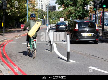 A Cyclist using the new temporary cycle lane along Molesworth