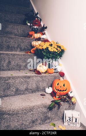 Pumpkins and decorations on stairs Stock Photo