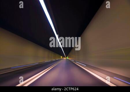 Illuminated Narrow Tunnel in San Bernardino, Grisons, Switzerland. Stock Photo