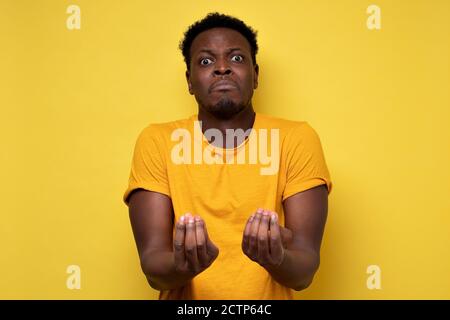 African american man doing a typical italian gesture, s arguing with his friend Stock Photo