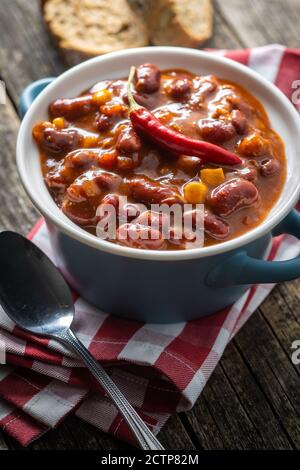 Chili con carne. Mexican food with beans in pot. Stock Photo