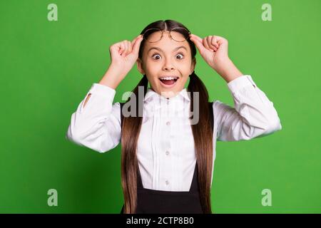 Photo of lovely pretty small lady in front of blackboard take off eyewear open mouth excited see interesting picture biology lesson wear white shirt Stock Photo