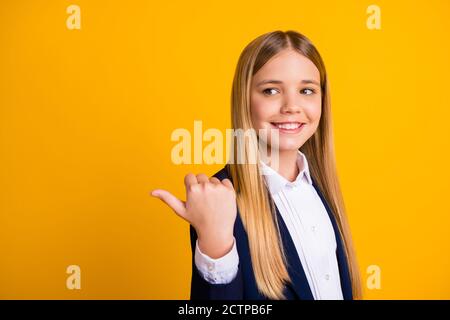 Close-up portrait of her she nice attractive pretty cheerful long-haired girl showing thumb ad advert copy space look idea academic isolated bright Stock Photo