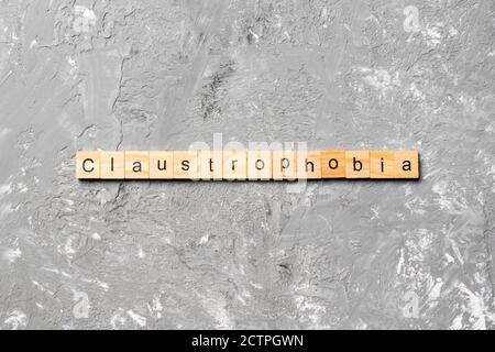 claustrophobia word written on wood block. claustrophobia text on table, concept. Stock Photo