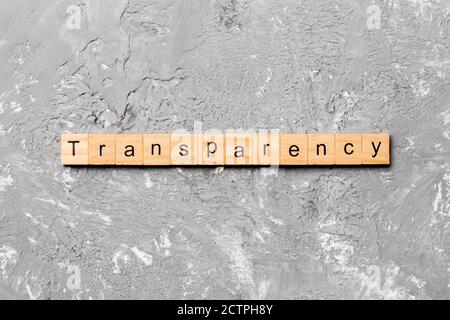 transparency word written on wood block. transparency text on table, concept.